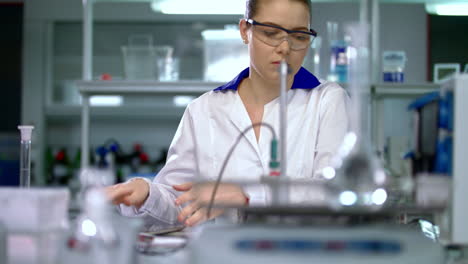 Scientist-woman-in-science-laboratory.-Woman-in-lab-coat.-Female-scientist